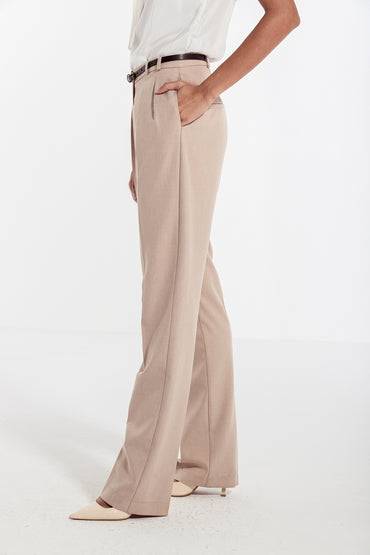 woman in beige classic front pleated pants