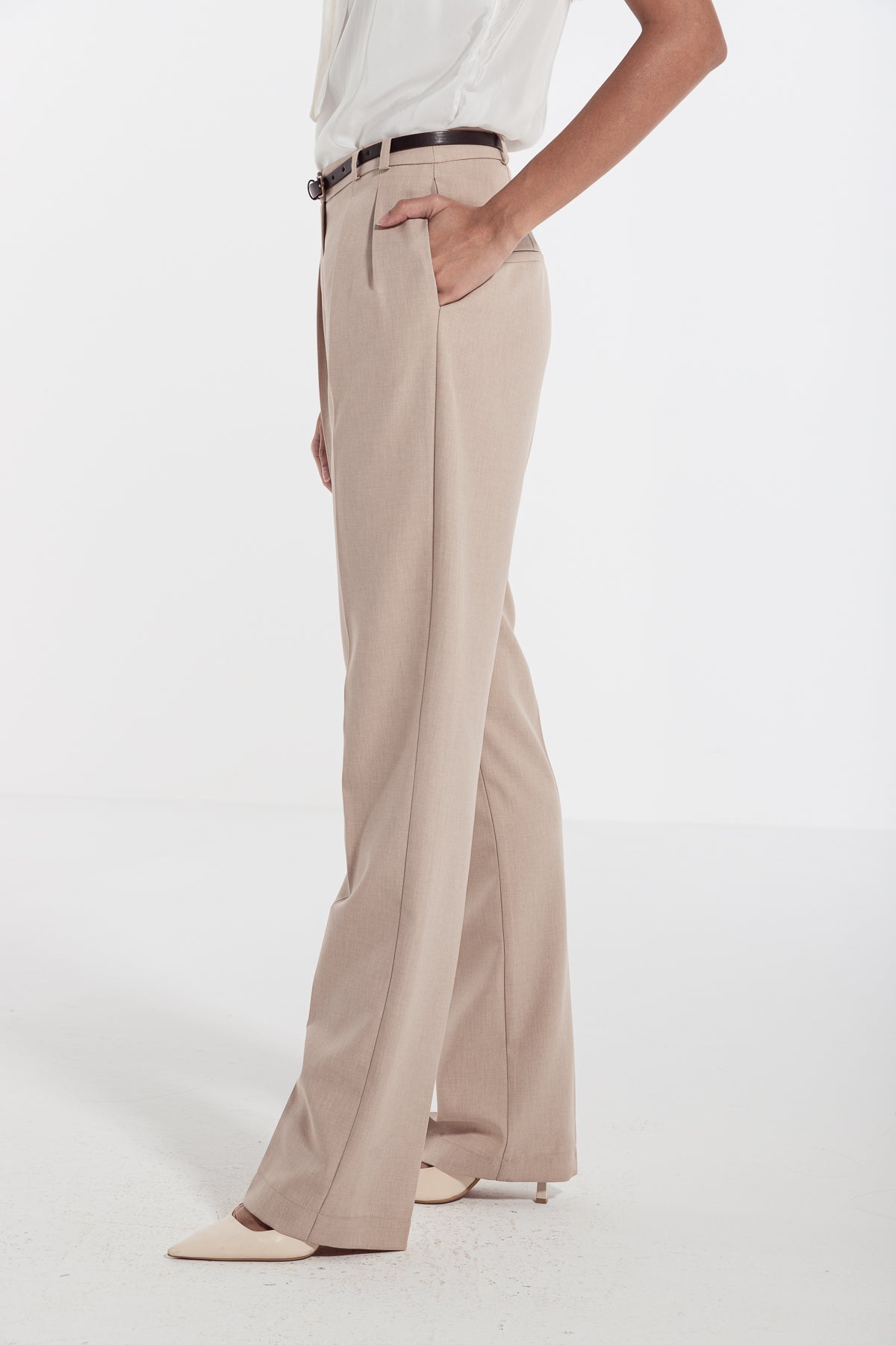 woman in beige classic front pleated pants