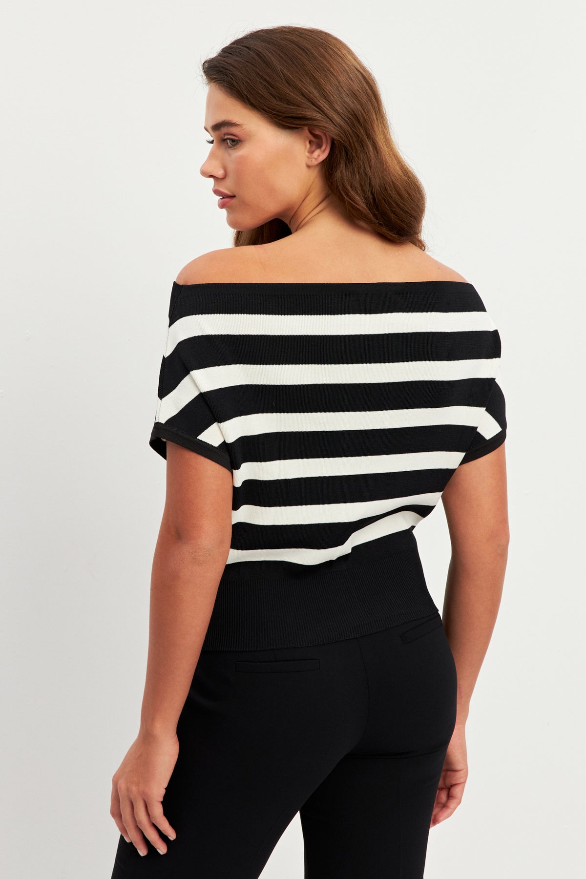 women in white and black striped top