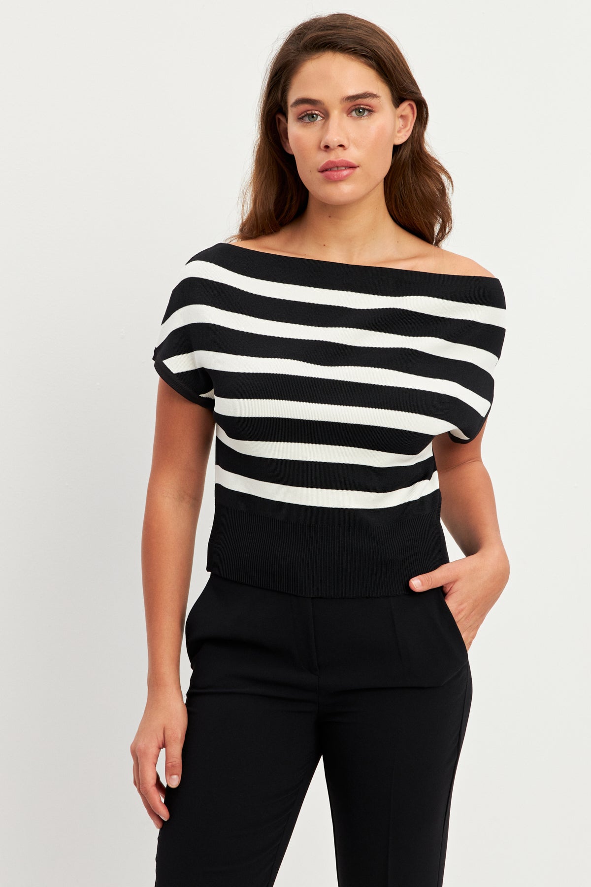 women in white and black striped top