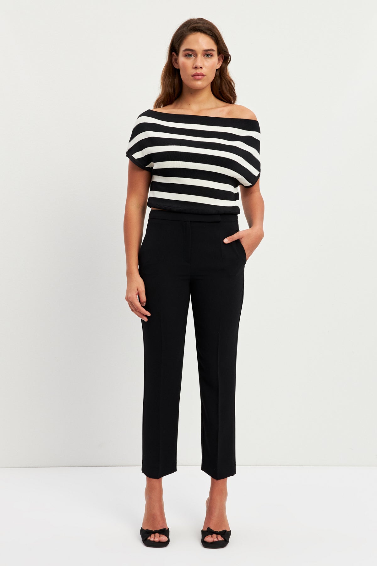 women in white and black striped top