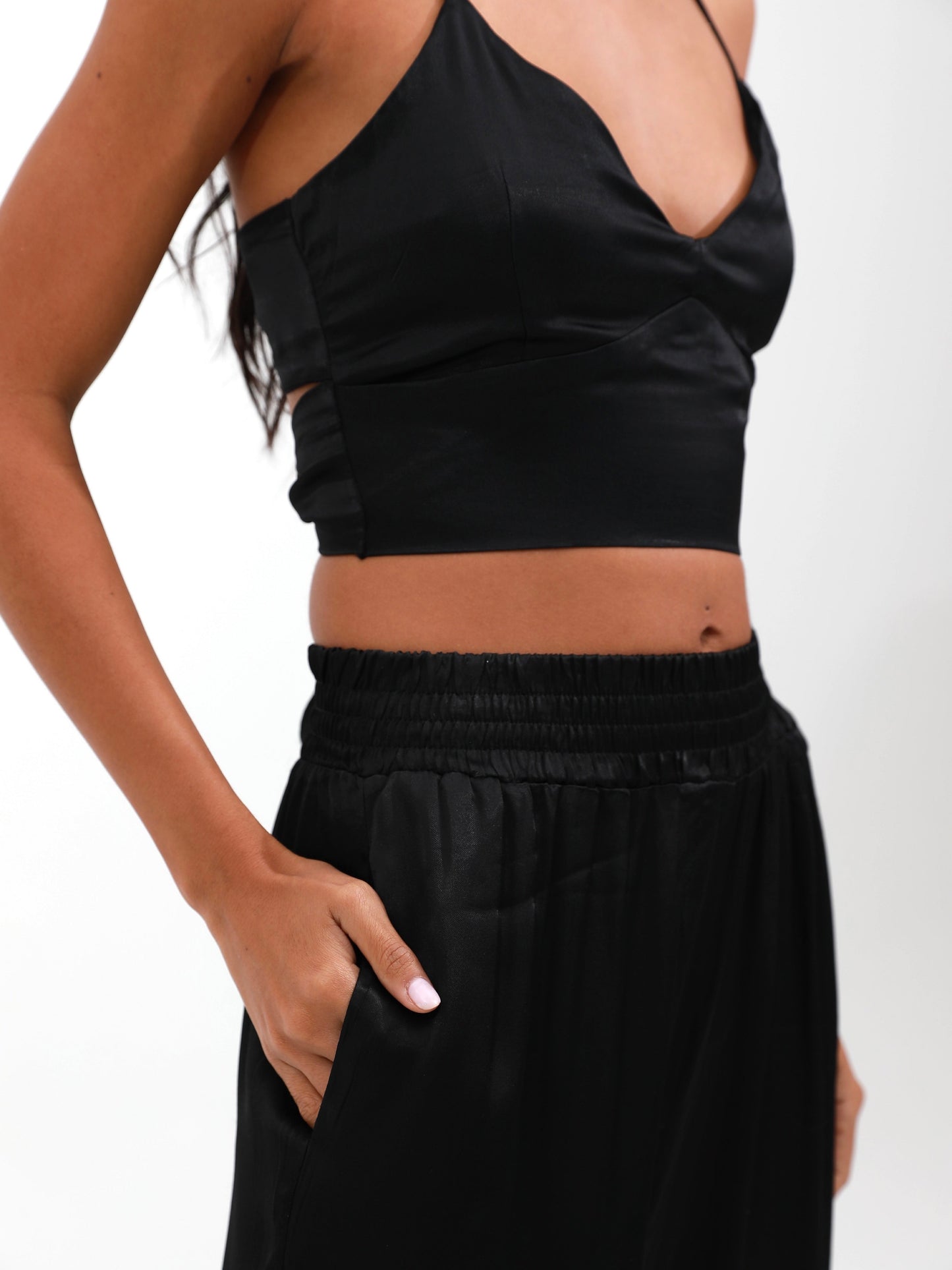 woman in black silk satin set