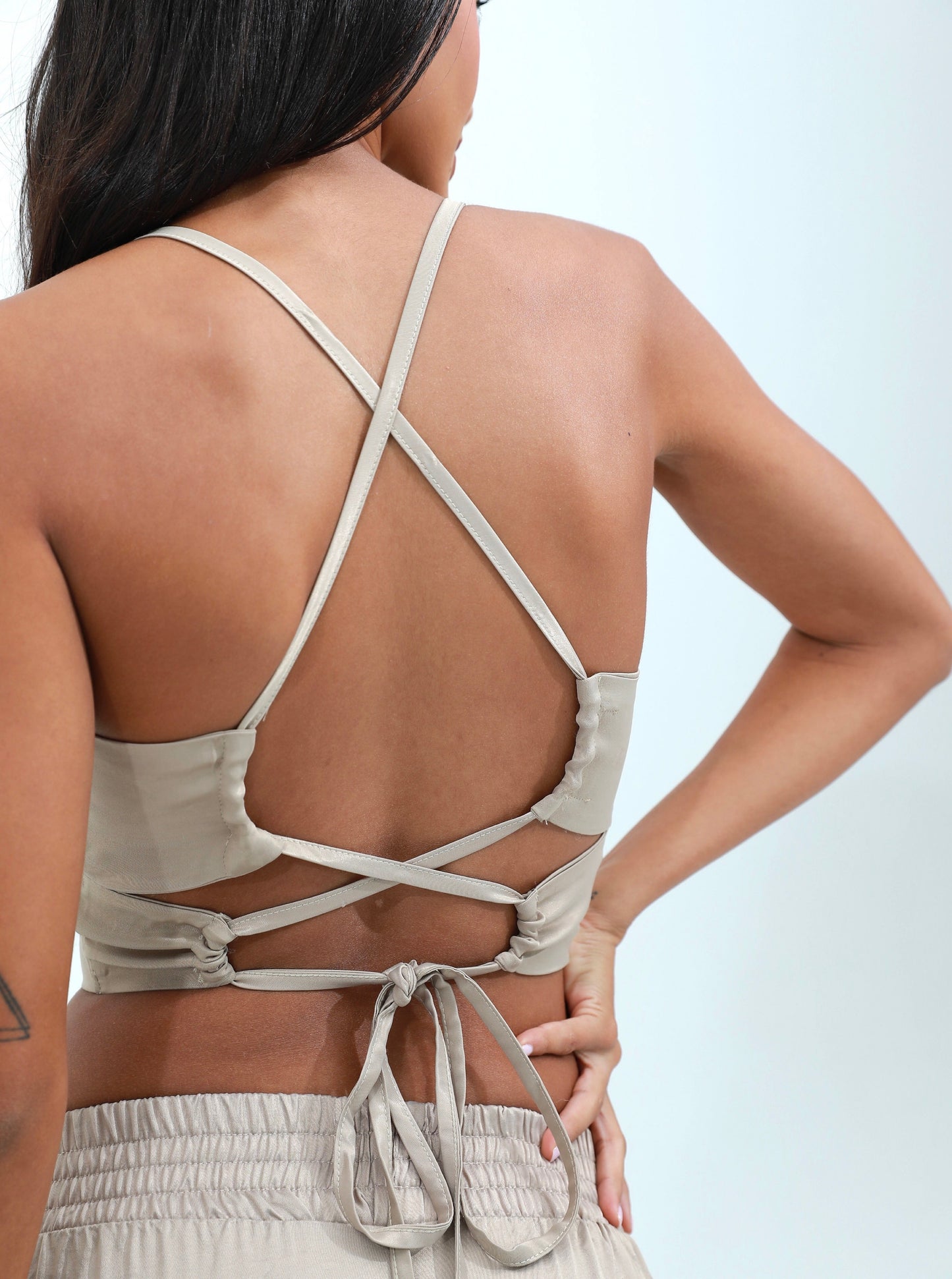 woman in beige silk satin set beige