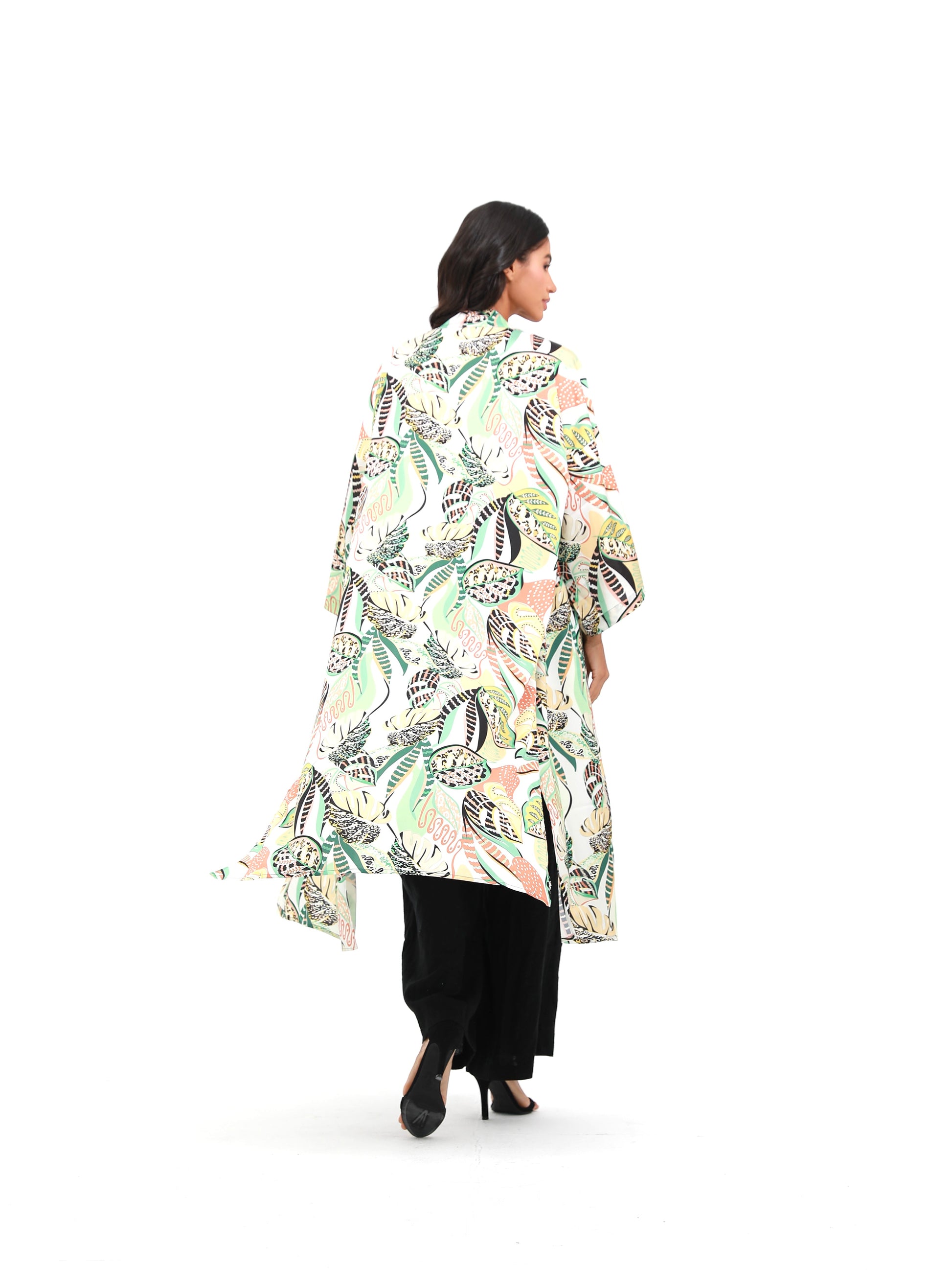 woman in summer kimono with tropical print palegreen