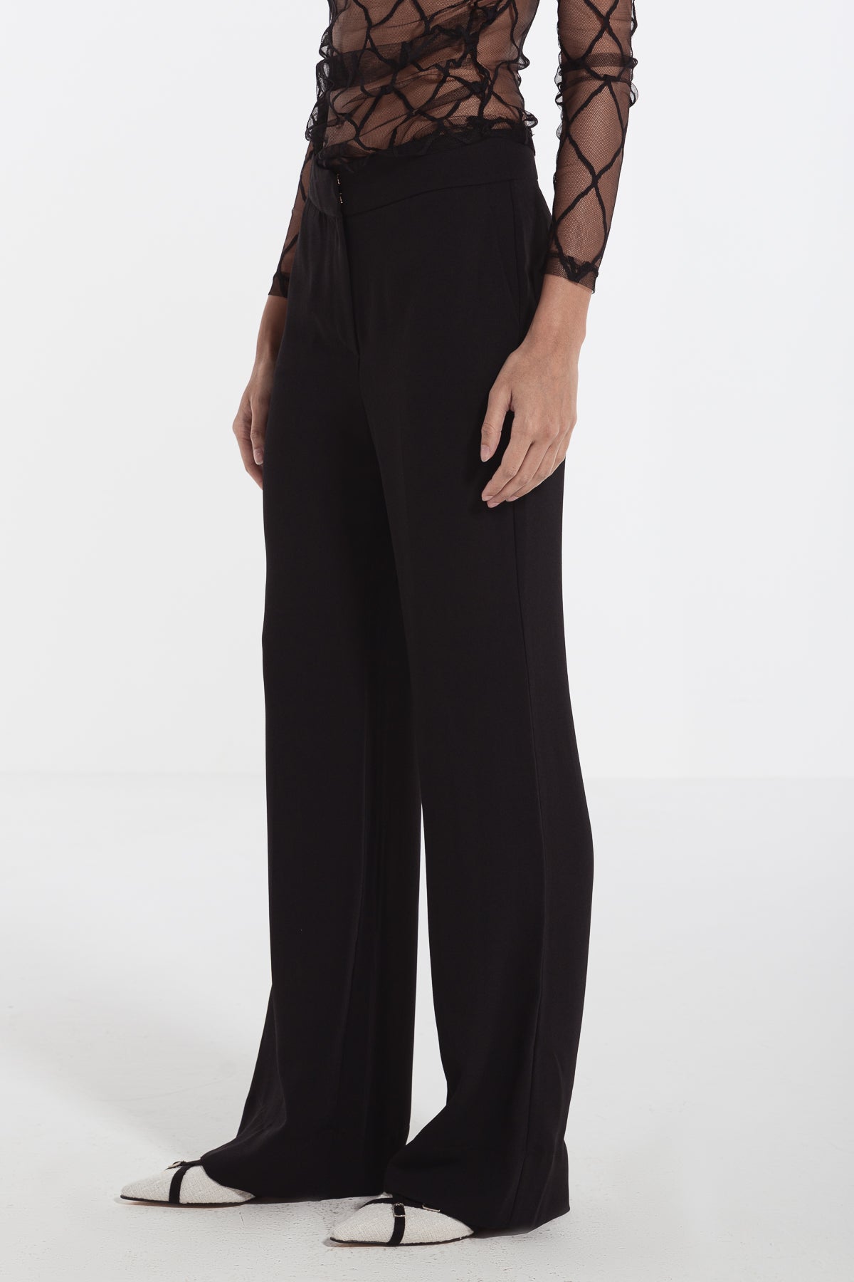 women in black straight leg crepe pants risska