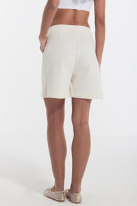 woman cotton shorts with gold chain ivory