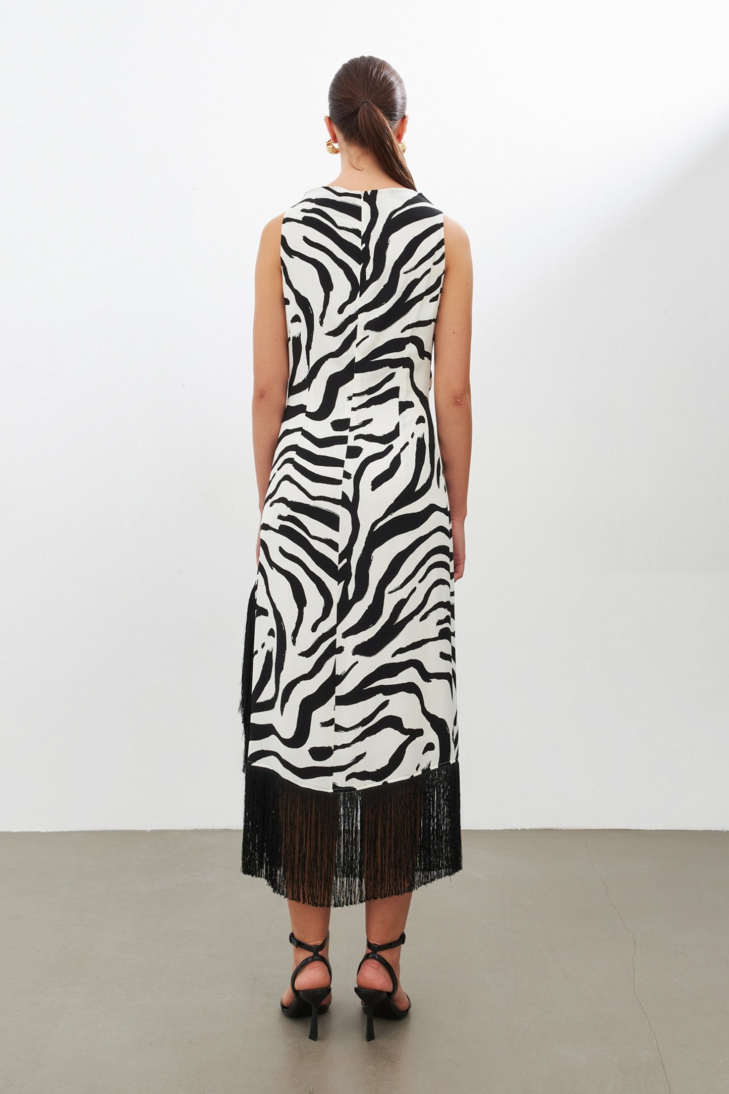 Black zebra print dress with side slit | fringe trim | risska