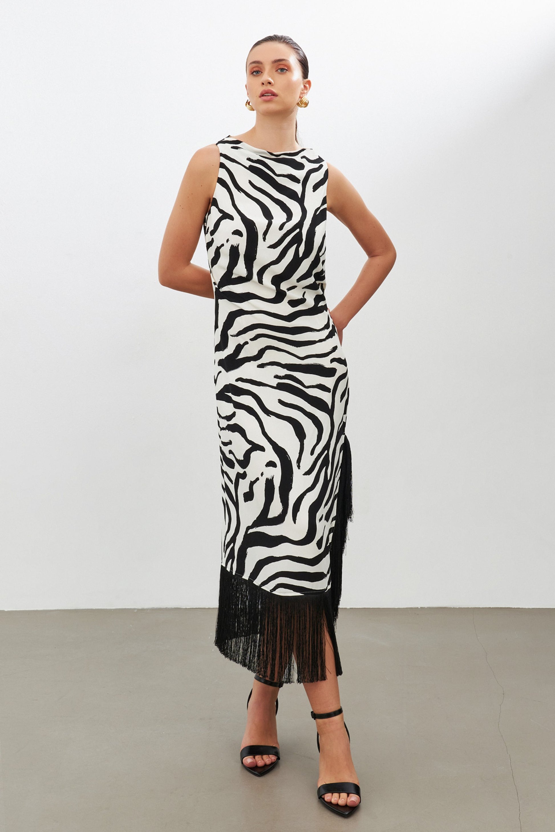 Black zebra print dress with side slit | fringe trim | risska