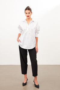 woman in cotton white |black striped shirt