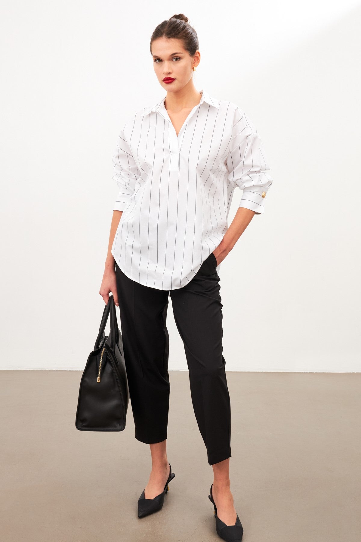 woman in cotton white |black striped shirt